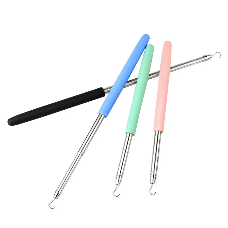 Accessories - Pink tool with clasps beside it